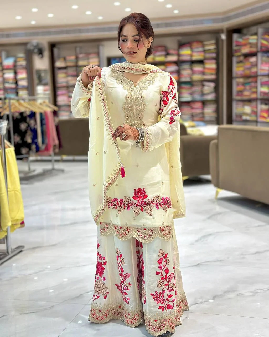 Festive and wedding wear for women in this beautiful white chinon silk sharara set with lots of embroidery.