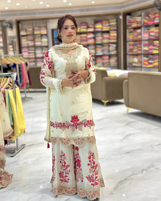 Festive and wedding wear for women in this beautiful white chinon silk sharara set with lots of embroidery.